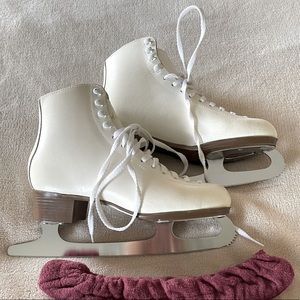 Woman’s size 7 Celebrity ice skates with 10 inch blades and blade covers